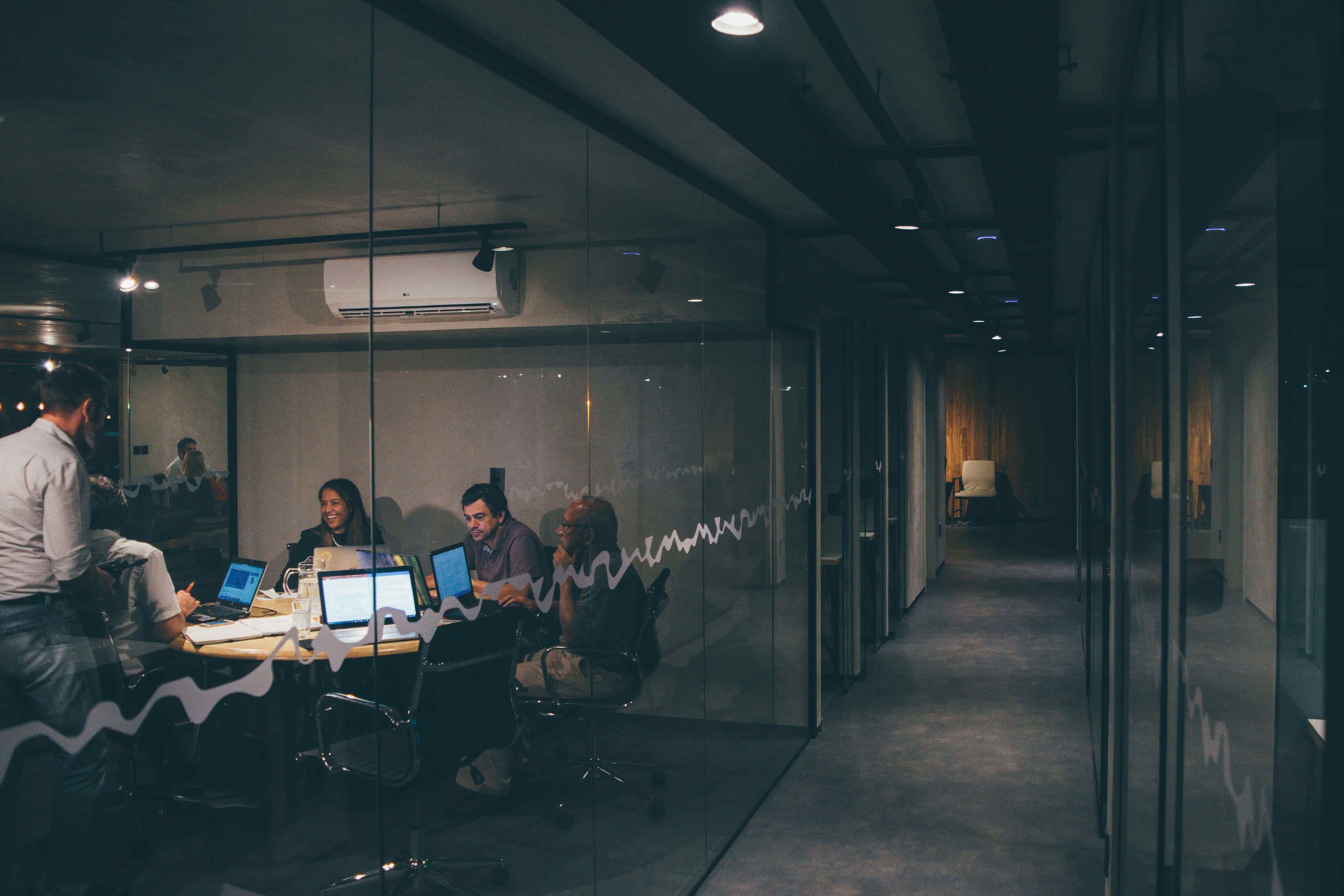 An outsourcing team collaborating in a modern office